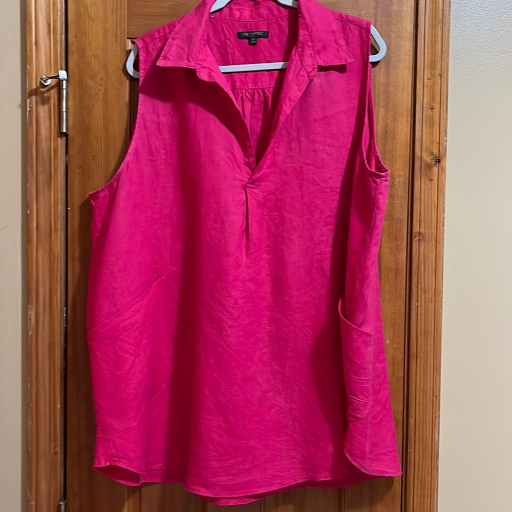 Deep pink sleeveless top.